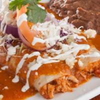 Entomatadas · (2) shredded chicken enchiladas topped with entomatada sauce, Monterrey Jack cheese, avocado...