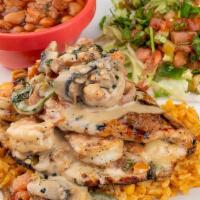 Pollo Del Mar · 7 oz. chicken breast stuffed with shrimp, tomatoes, cilantro, jalapeños, and onions, topped ...