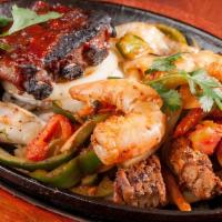 Mariachi Loco · New. Baby back ribs, sautéed shrimp, beef, and chicken fajitas sautéed with onions, tomatoes...