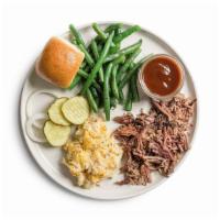 Brisket · 1/4 lb pulled brisket. Served with two sides and a roll.