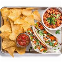 Sweet Potato Taco Plate · Two tacos (1 flavor) containing roasted sweet potato, aji verde, and crema. Served with ranc...