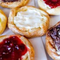 Danishes · Your choice of cream cheese, strawberry, cherry, hazelnut spread with banana slices.