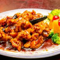 Orange Chicken · Lightly fried chicken sautéed with minced orange peels and spices.