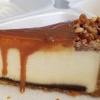 Cheesecake - Caramel Fudge · The classic new York recipe with a thick layer of caramel glaze on top. The edge is garnishe...
