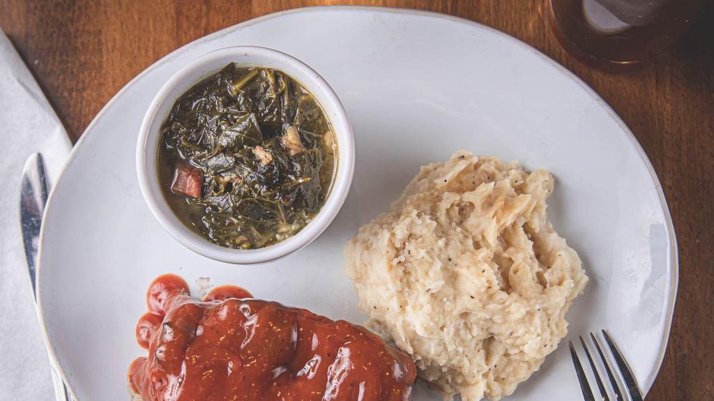 Big Daddy'S Meatloaf · Not your moms meatloaf. Hereford ground beef, pork, garlic, onions, celery, and bell peppers topped off with big daddy's meatloaf sauce. Served with roasted garlic mashed potatoes and collard greens.