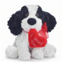 Plush Poppy I Woof You  · Black and white plush puppy with a sheer red ribbon tied around his neck and a red heart pil...