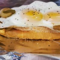 The Hang-Over · Vienna beef 1/4 lb'er with grilled onions. Jalapeño and a sunny side up egg on top.