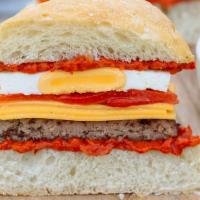 Sausage & Egg Ciabatta · Cheddar cheese, roasted red peppers, red pepper pesto, egg,. ciabatta bread.