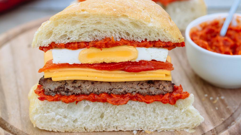 Sausage & Egg Ciabatta · Cheddar cheese, roasted red peppers, red pepper pesto, egg,. ciabatta bread.