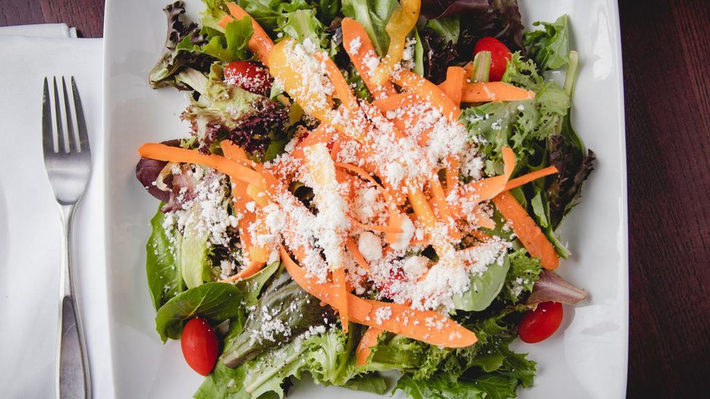 Spring Mixed  Salad · Spring mixed lettuce, tomatoes, bell pepper, olive, feta, onion, and house-made Greek dressing.