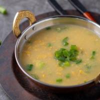 Sweet Corn Soup · Sweet corn added with ginger garlic and spring onions in vegetable stock.