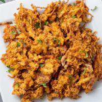 Mixed Vegetable Pakoda · Fresh veggies (carrot, onion, cabbage, mixed pepper) mixed with chickpeas flour and fried to...