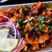 Chili Chicken Dry · Juicy boneless chicken cubes stir fried with soy sauce, chili sauce, fresh green chilies, sp...