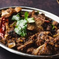 Karaikudi Mutton Pepper Fry · Delicious semi-dry tender goat cubes with bone cooked along with onion, black pepper and oth...