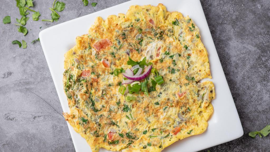 Masala Egg Omelet · South Indian omelet made with finely chopped onion, green chilies & tomatoes.
