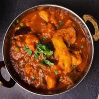 Vindaloo - Veg · Tangy, spicy curry cooked with garlic, vinegar red chilies and potato.(Spicy)