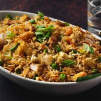 Chicken Fried Rice · Stir fried rice and chicken with light and aromatic touch of soy sauce and ginger.