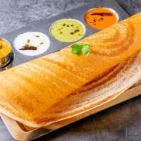 Plain Dosa · Thin south Indian crepe made with fermented rice and lentil mixture. Served with chutney and...
