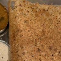 Rava Dosa · Dosa made with semolina, cumin, ginger, coriander leaves and green chilies. . Served with di...