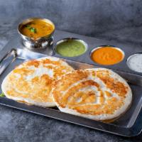 Plain Uthappam  - 2 Pieces · Thick South Indian savory pancake made from fermented rice and lentil batter mix. Served wit...