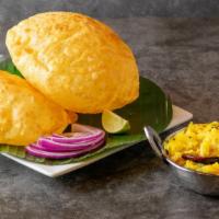 Poori Combo - 2 Pieces · Unleavened wheat flour bread, deep fried and served with Chana Masala.