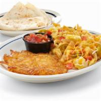 Migas · Scrambled eggs with Jack & Cheddar, onions, jalapenos, tomatoes & tortilla strips. Served wi...