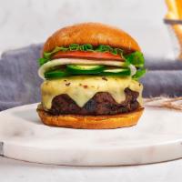 Jalapeno Jeopardy Burger · Grass-fed Angus beef patty topped with melted cheese, jalapenos, lettuce, tomato, onion, and...