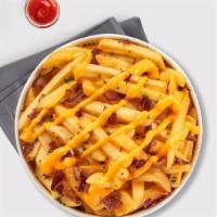 Loaded Fries · Idaho potato fries cooked until golden brown and garnished with salt, melted cheddar cheese,...