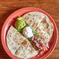 Quesadilla · Fresh flour tortillas stuffed with monterey jack cheese and choice of beef, chicken or shrimp.