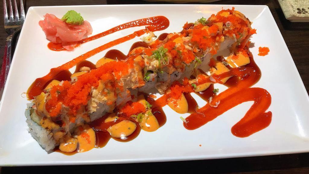 Ye'S Ichiban Roll · Shrimp tempura roll topped with oven baked salmon & crab meat mix, spicy mayo, chili sauce, eel sauce, masago and green onion.