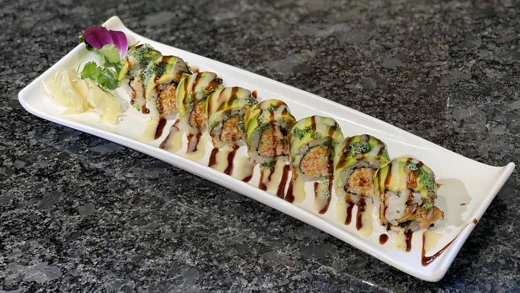 Green Forest Roll · Eel, spicy crunchy crabmeat rolled, topped with avocado, eel sauce, honey mayo and masago. Spicy.