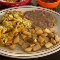 Migas Plate · Spicy. Crispy corn tortilla, mixed with onions, hot peppers, tomato, egg and cheese.