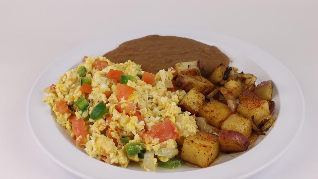 Huevos A La Mexicana Plate · Our spicy scrambled eggs. Jalapeño, onion, tomatoes. Served with two sides only rice, beans, or potatoes.