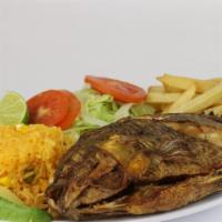 Mojarra Frita · Fried whole tilapia fish served with rice, salad, and French fries.