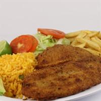 Filete A La Plancha O Empanizado · Grilled or fried tilapia fillet served with rice, salad, and French fries.