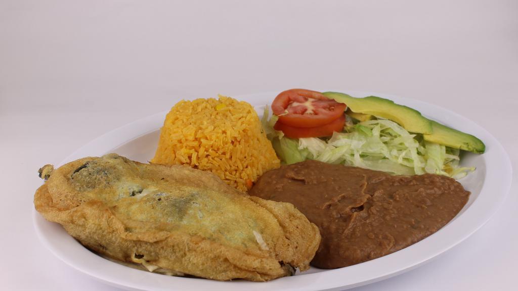 Chile Relleno · A large cheese stuffed poblano pepper. Served with rice, beans, salad and corn or flour tortillas.