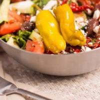 Greek Salad · with feta, sun dried tomatoes and kalamata olives.