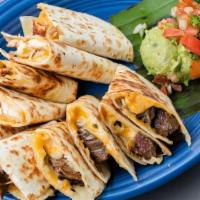 Combo Quesadilla · Mesquite grilled fajita chicken and steak, melted cheese & green chiles. Served with guacamo...