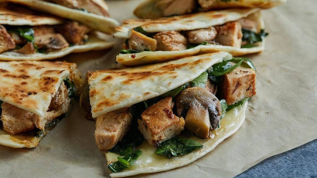 Blue Goose Quesadilla · Mesquite grilled chicken, melted jack cheese, fresh spinach & mushroom. Served with guacamole & pico de gallo.