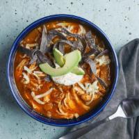 Chicken Tortilla Soup · Homemade tortilla soup with jack cheese, avocado & tortilla strips