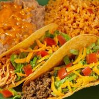 Og Tacos · Two pulled chicken or ground beef tacos in a crispy or soft tortilla topped with lettuce, to...