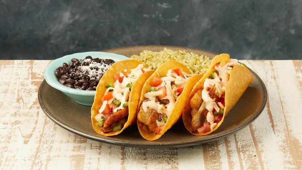 Tacos Frescos · Three crispy tacos with blackened tilapia, pico de gallo & jack cheese. Topped with chipotle mayo. Served with poblano lime rice & black beans.