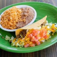 Kids Beef Taco · A soft or crispy beef taco w/ lettuce, tomato & cheese. Served w/ rice & refried beans.