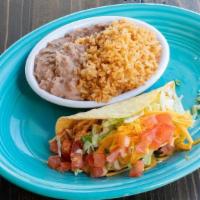 Kids Chicken Taco · A soft or crispy chicken taco w/ lettuce, tomato & cheese. Served w/ rice & refried beans.