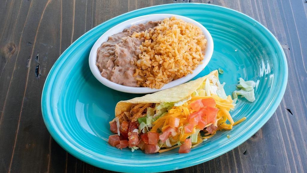 Kids Chicken Taco · A soft or crispy chicken taco w/ lettuce, tomato & cheese. Served w/ rice & refried beans.