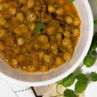 Chana Masala · Garbanzo beans cooked with onions, tomatoes and spices.