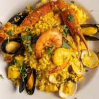 Seafood Paella · A colorful rice dish bursting with shrimp octopus, fish, mussels, crab legs and saffron for ...