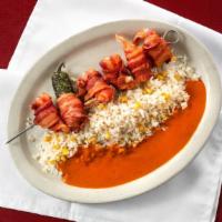 Camarones Envueltos / Wrapped Shrimp · Bacon wrapped shrimp filled with Oaxaca cheese over a bed of white rice  in morita chile sauce