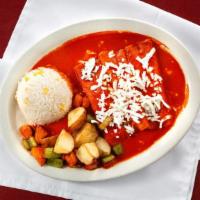 Enchiladas Norteñas / Northern Enchiladas · Filled with queso fresco and onion, topped with cascabel pepper sauce and served with rice, ...