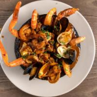 Molicajete Levanta Muertos · Combination of seafood: Shrimp, octopus, mussels, clams, fish and crab legs in a spicy
seafo...